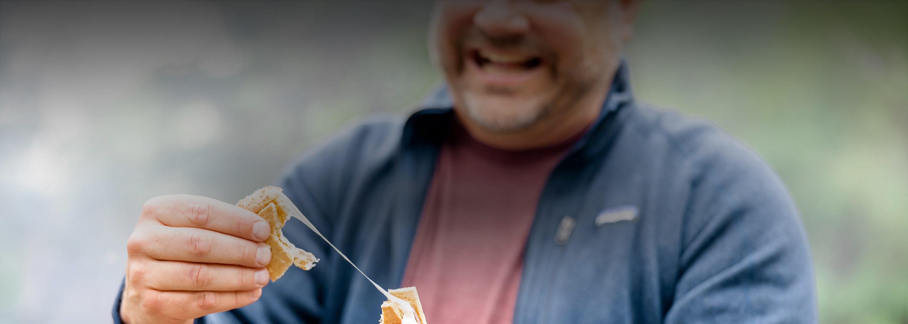 blurred image of man breaking food